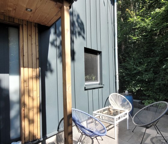 Ferienhaus mit Terrasse im Grünen Ferienhaus mit Terrasse im Grünen