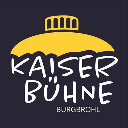 Ein einfaches, modernes Logo mit dem Schriftzug "Kaiser Bühne" in verspielter Schrift. Das Design enthält eine gelbe Kuppel über dem Text und ist auf einem dunklen Hintergrund platziert.