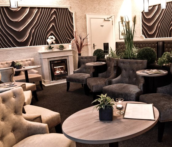 cosy lounge with relaxing chimney fire, &copy; A. R&uuml;ber