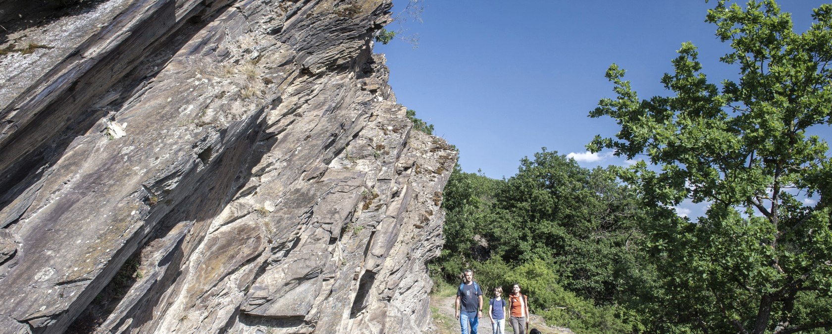 Hiker with dog at the rock passage, © kappest_remet